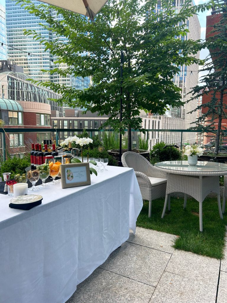 white table cloth over table to set up a bar next to a dining table