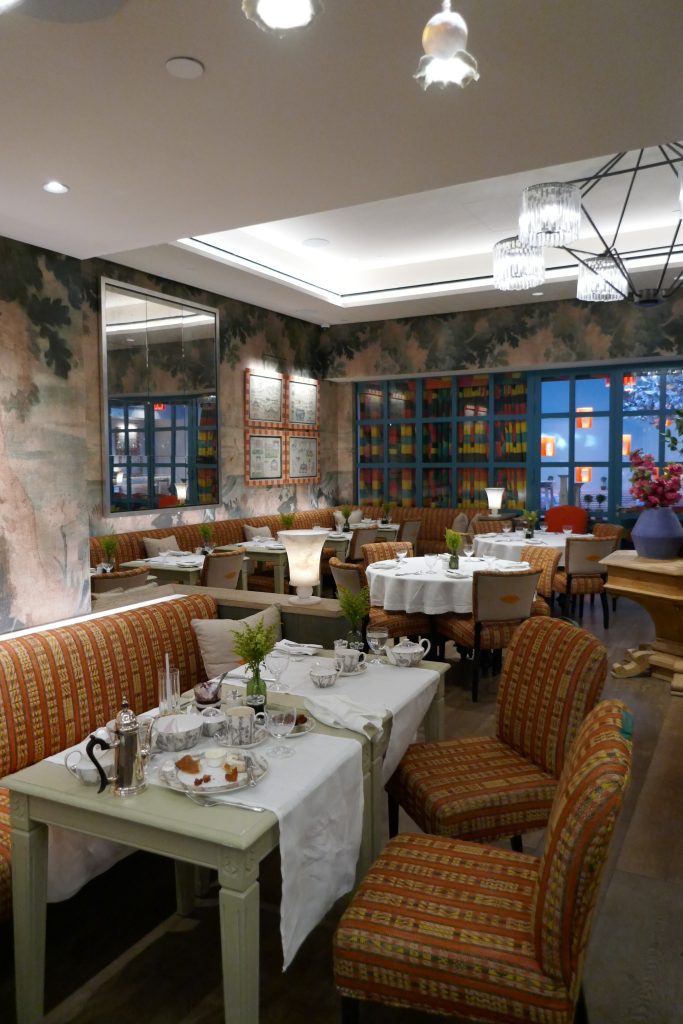 dining area set up with white table cloths