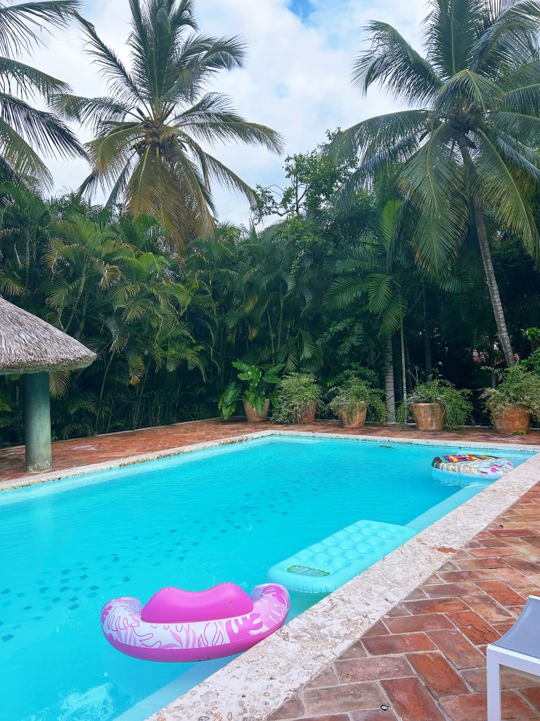 pool in shade with pink float in it