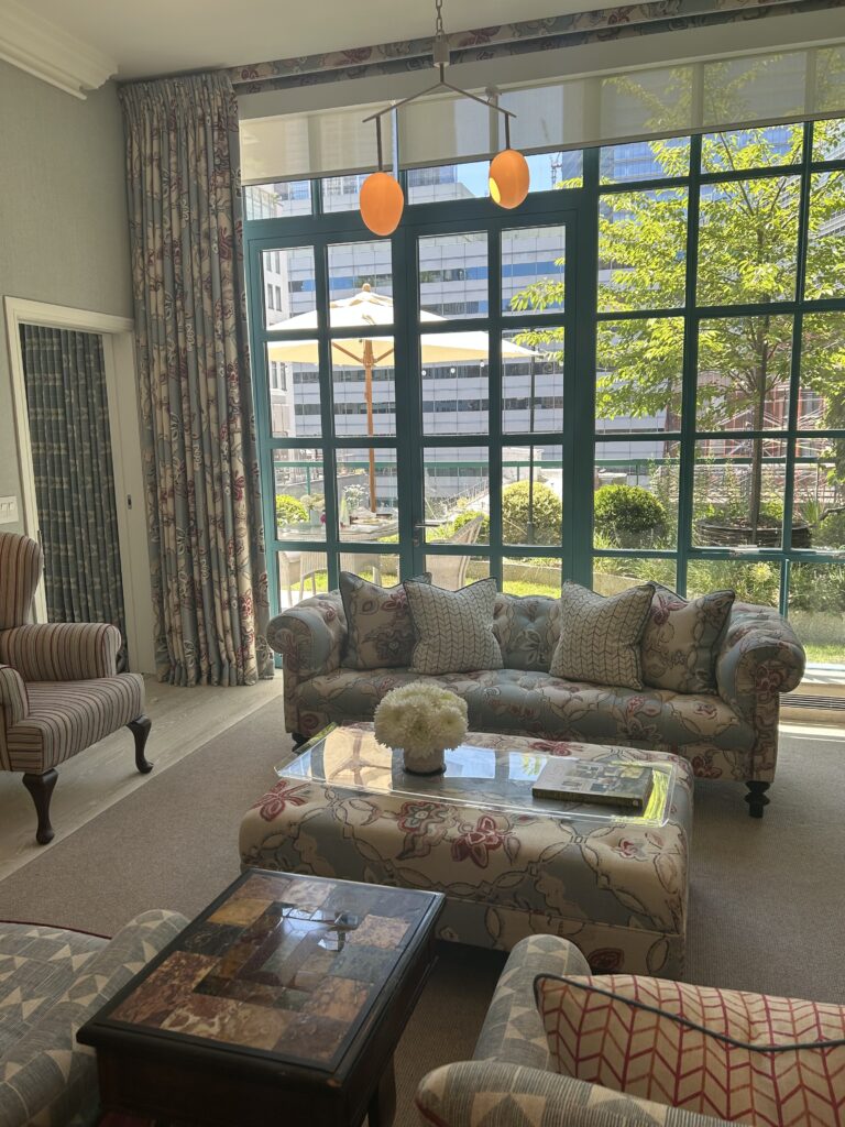 patterned couch with pillows and outdoor terrace