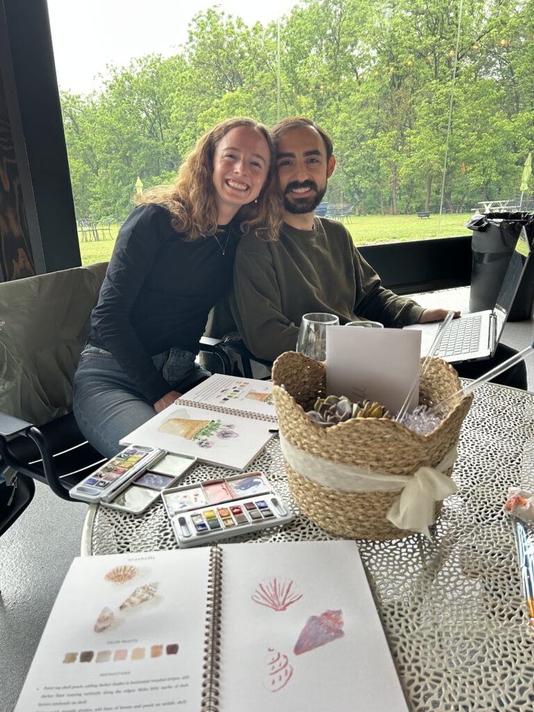 woman and man in front of watercolor set