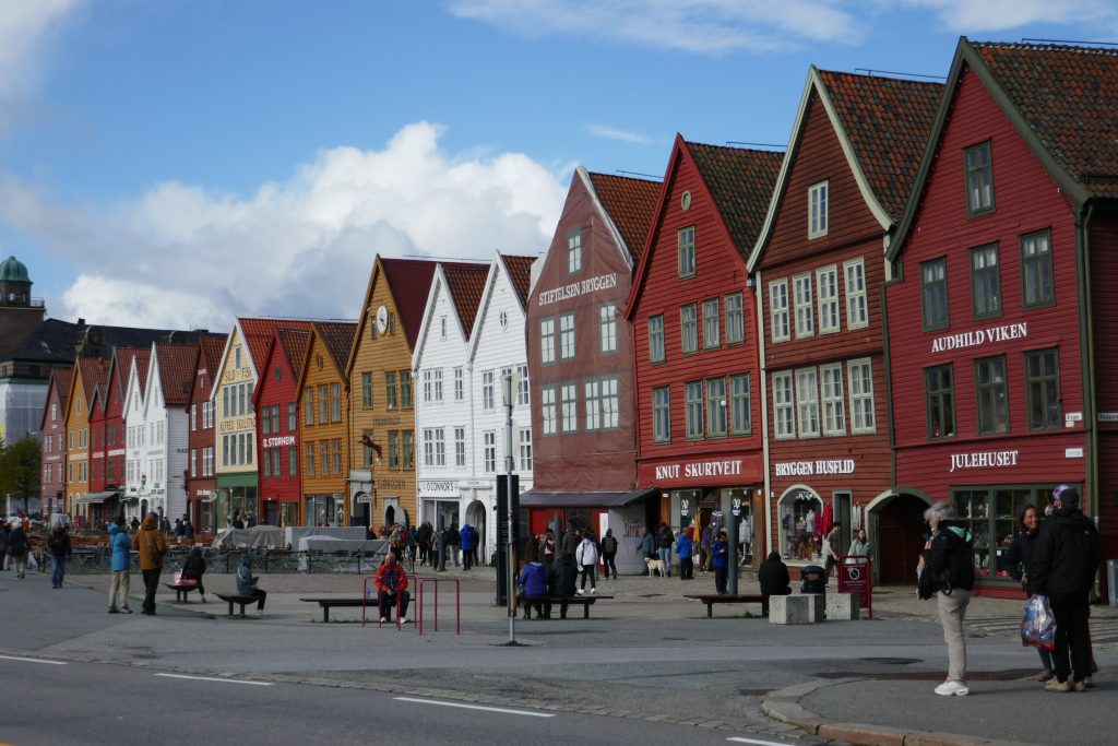 red, white, and brown houses on a pedestrian street