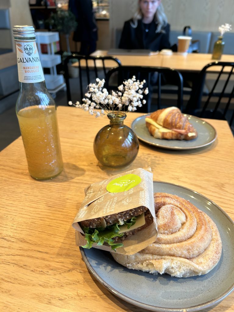 breakfast sandwich and bun on a table with flowers
