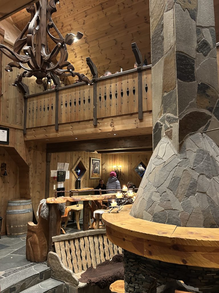 wooden fire place with wooden chandelier 
